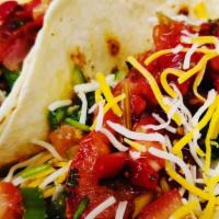 Tacos · Two perfectly seasoned ground beef, chicken, or steak, fresh lettuce, five blend cheese, top...
