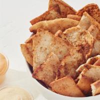 Pita Chips & Hummus · Freshly baked pita chips with housemade hummus