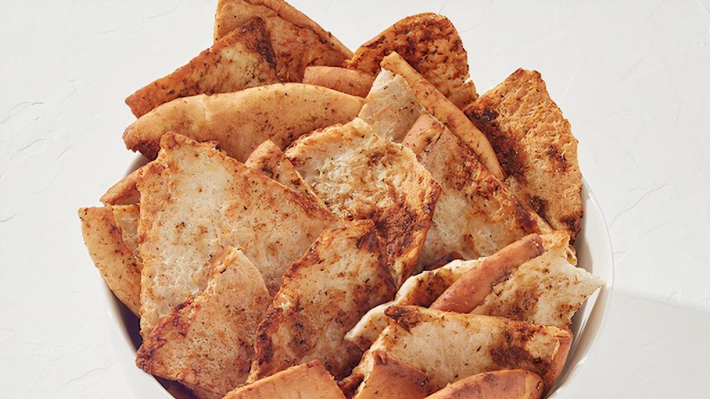 Seasoned Pita Chips · Freshly baked and seasoned pita chips