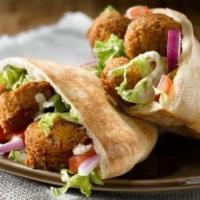 Falafel Sandwich · Vegetarian. Falafel patties (fried) wrapped in pita bread with lettuce, tomato, pickles, and...