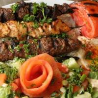 Mixed Kabob · Lamb chops, kofta kebab, and shish taouk with grilled vegetables. Served with pita, rice and...