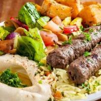 Kofta Kebab · Beef. Charbroiled ground beef with grilled vegetables. Served with pita, rice and side of tz...