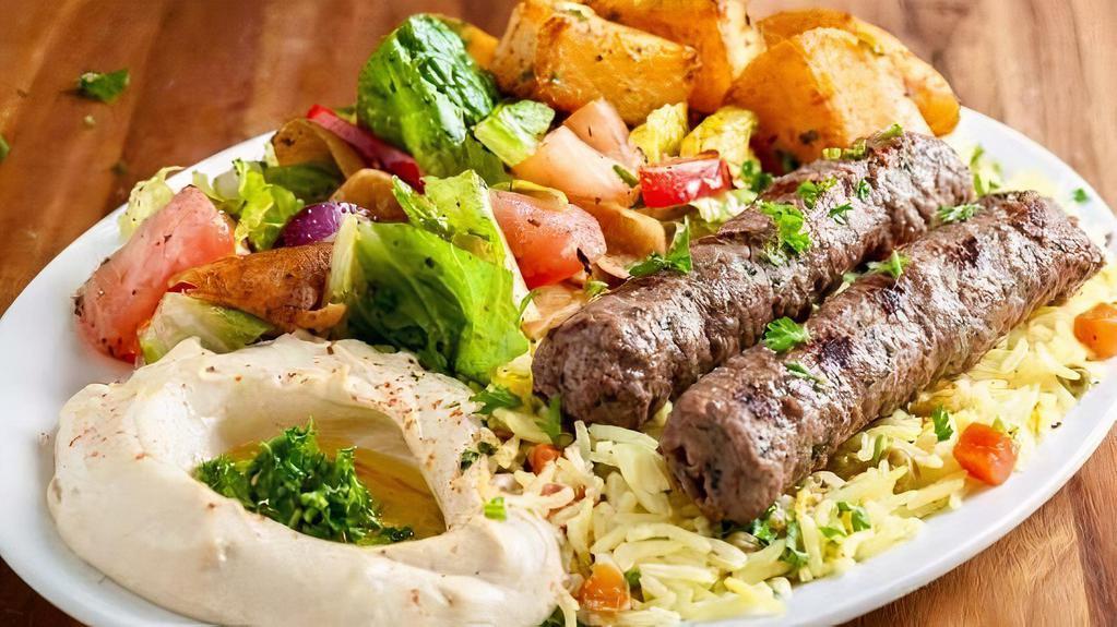 Kofta Kebab · Beef. Charbroiled ground beef with grilled vegetables. Served with pita, rice and side of tzatziki.