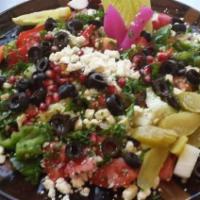 Marinated Feta Salad · Vegetarian. Feta cheese, olive, onions and tomatoes marinated in olive oil. Served with pita...