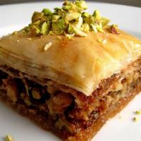 Pistachio Baklava · Fillo dough, stuffed with crushed pistachios, drizzled in rose water syrup.