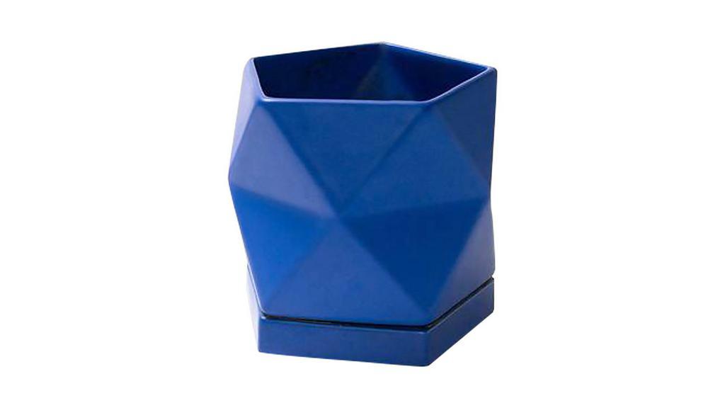 Pentagonal Planter · The pentagonal planter is a uniquely shaped ceramic planter with a drainage hole and seamless saucer. It is designed by Mexico City-based artist Laila Salomon. Add a bag of potting soil to pot your favorite plant inside. 

Fits any plant in a 4