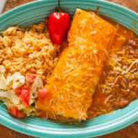 Burrito · Flour tortilla stuffed with chicken or beef, rice and beans, and baked in enchilada sauce an...