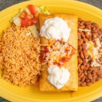 Chimichanga · Flour tortilla stuffed with chicken or beef, rice and beans, and deep fried, topped with sou...
