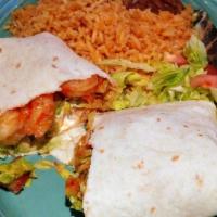 California Burrito · Made with grilled marinated chicken, steak or shrimp, served with peppers, onions, cheese an...