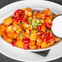 Blue Devil Tater Tots (Gf) · tossed in sriracha hot honey sauce, topped with melted blue cheese and sliced jalapeños, ser...