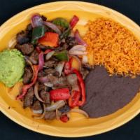 Steak Fajitas · Grilled marinated steak strips with peppers and onions, served with three flour tortillas an...
