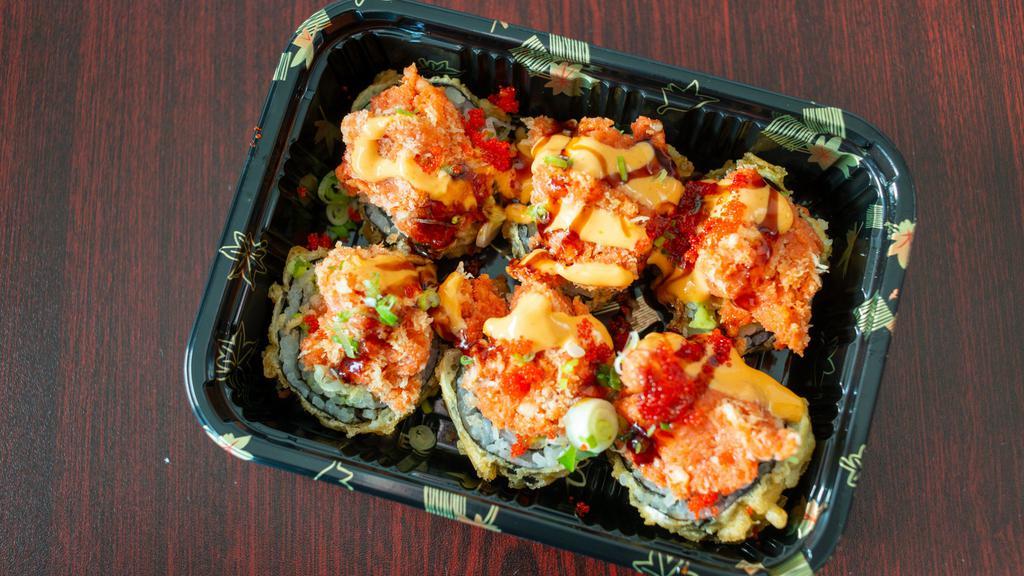 Volcano Roll · Tempura fried crab avocado roll, topped with spicy tuna, spicy mayo, eel sauce and tobiko.