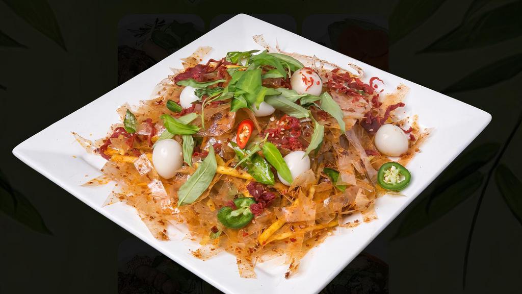 Banh Trang Tron (Beef Salad) · Beef salad with green mango, quail eggs, and rice paper. Hot and spicy.
