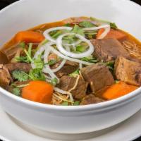 Bo Kho (Beef Stew)  · Beef stew with sliced onions and carrots, with a choice of yellow/rice noodles or Vietnamese...