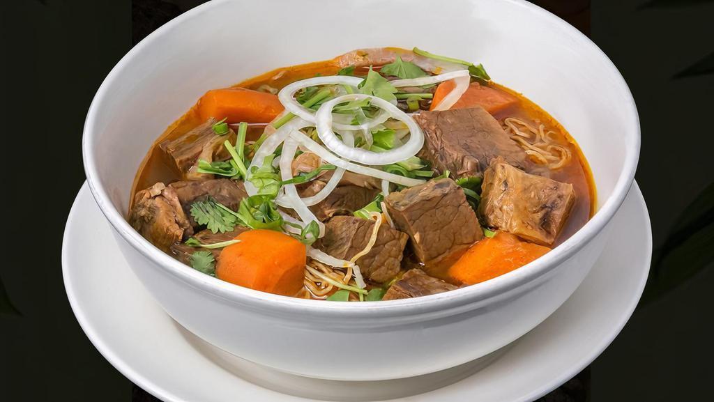 Bo Kho (Beef Stew)  · Beef stew with sliced onions and carrots, with a choice of yellow/rice noodles or Vietnamese baguette.