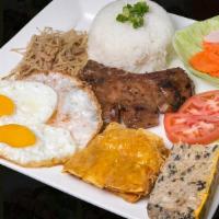 Com Dac Biet · Broken rice with pork chop, shredded pork skin, pork egg custard, fried egg, and deep fried ...