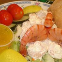 Shrimp Salad Plate · Served over a bowl of garden salad with vinaigrette dressing and lemon.