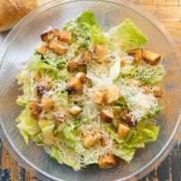 Caesar Salad · Crisp romaine lettuce with seasoned croutons, Parmigiano cheese & creamy caesar dressing.