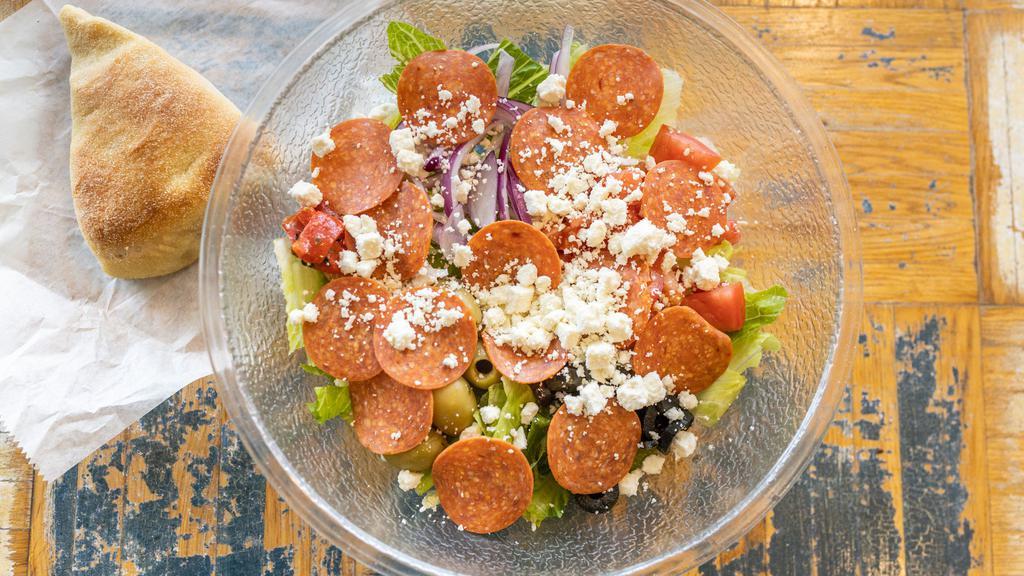 Greek Salad · Romaine lettuce, olives, pepperoni, red onions, roasted peppers, feta cheese, tomatoes, and grilled chicken.
