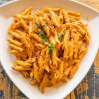 Penne Vodka · Tomato cream sauce flamed with vodka sauce.
