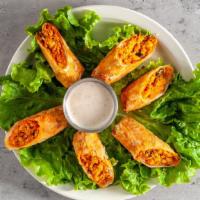 Southwestern Egg Rolls · Spicy chicken, corn, black beans, peppers, onion and melted cheese served with Cajun ranch s...