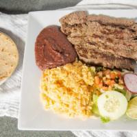 Carne Asada · Grilled steak served with rice, beans, salad and tortillas