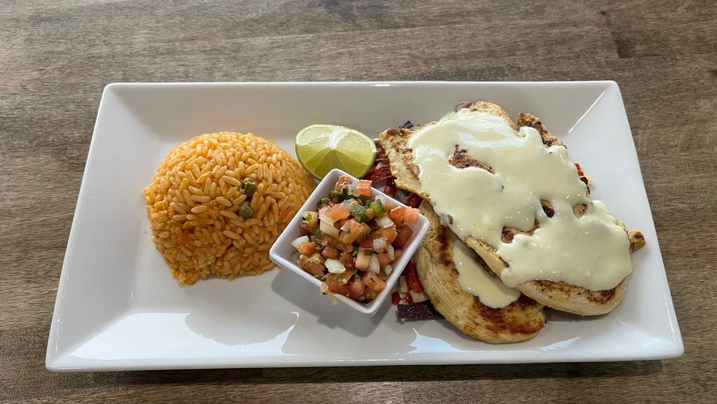 Pollo Fiesta · Grilled chicken breast served with rice, tortilla strips, cheese dip, pico de gallo and lime