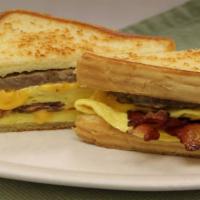 Morton Monster Breakfast Sandwich · Two scrambled eggs, bacon, sausage and cheese on Texas toast.