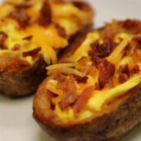 Breakfast Potato Skins · Two potato skins filled with scrambled eggs, chopped bacon and cheddar cheese  with a side o...