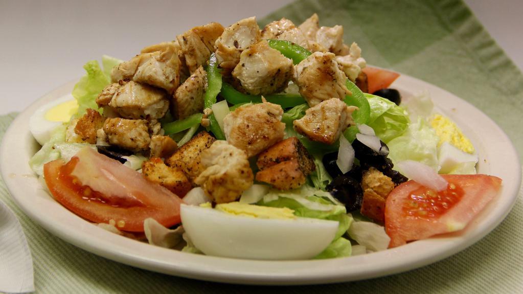 Tossed Salad · Iceberg lettuce, Tomato, Onion, Boiled Egg, Green Peppers, Black Olives and croutons.