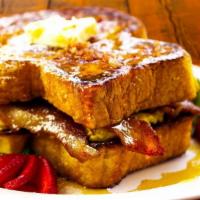 Deluxe Sandwich · Choice of meat and two scrambled eggs on french toast.