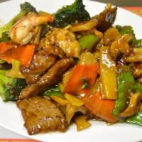 Triple Delight · A unique combination of shrimp, chicken and beef sautéed quickly with vegetables in a tasty ...