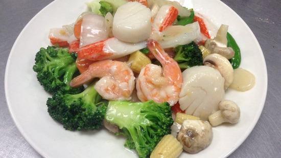 Seafood Delight · Combination of fresh shrimps, scallops and lobster meat sautéed with mixed vegetables in light sauce.