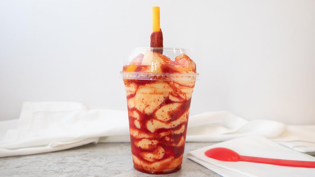 Mangonada · Blended sour mango drink with tajin & chamoy. Served with candy straw.
