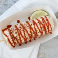 Traditional Elotes · mayo, cotija cheese, chili powder, and a valentina sauce drizzle