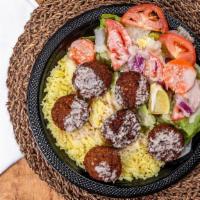 Falafel · Chick peas mixed with various spices, lettuce, tomato, onion, hummus.