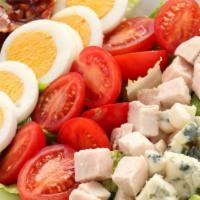 Cobb Salad · Fresh salad prepared with chopped romaine lettuce, tomato, crispy bacon, grilled chicken, bo...