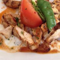 Chicken Shish Kebab · Marinated chunks of chicken breast skewered with onions, tomatoes, green peppers. Served wit...