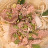 Beef Noodle Soup · Sliced flank steak beef, chives, beansprouts, snow peas, carrots, and flat rice noodles in c...
