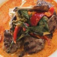 Rack Of Lamb · Grilled lamb with green peppercorn, basil, cognac red coconut curry sauce. Menu item with a ...