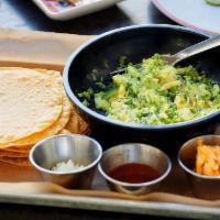Guacamole · Our house-made guacamole served with corn chips and our pimento cheese and salsa.