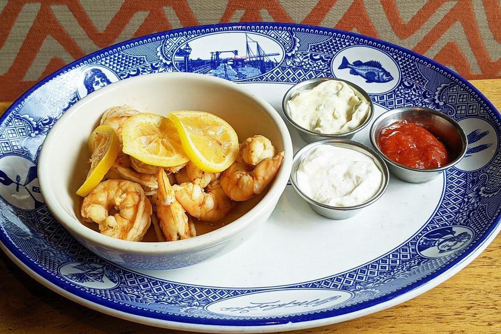 Spicy Steamed Shrimp · Shrimp steamed and tossed in our house-made rub with Old Bay seasoning & cayenne. Served with horshradish cream, cocktail, and tartar sauce.
