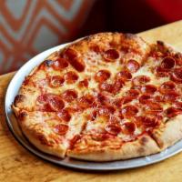 Pepperoni Pizza · Topped with our red sauce and crushed tomatoes, shredded mozzarella & pepperoni, and crushed...
