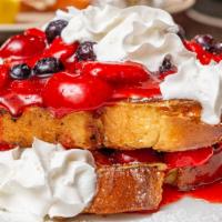 Stuffed French Toast · Cream cheese, strawberries & blueberries topped with whipped cream.