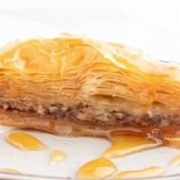 Baklava · Light flaky phyllo dough layered with honey, cinnamon, and nuts. This is an extra-rich yummy...