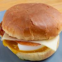 Bacon, Egg And Cheese · Smoked bacon and white cheddar over a soft boiled egg. The toasted potato bun give it integr...
