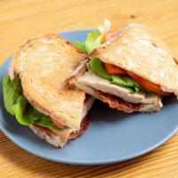 Turkey Club · Deli style Turkey Breast, smoky Bacon, Tomatoes and Boston butter Lettuce on toasted French ...