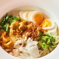 Royal Tofu Noodle · Steam udon rice noodle, creamy coconut tofu sauce, boiled egg, sweet onion, garlic and scall...