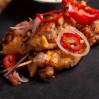 Chicken Skewers · Brined and marinated overnight with in red pepper relish.