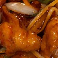 Orange Chicken · Crispy chicken with bell peppers, onions and scallions in a tangy spicy sauce. Spicy.